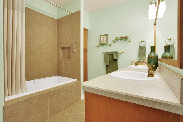 bathroom featuring vanity, tile patterned flooring, and shower / bath combo