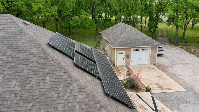 502 Smith Oak Rd, Sherman, TX 75090 - garage featuring roof mounted solar panels and driveway