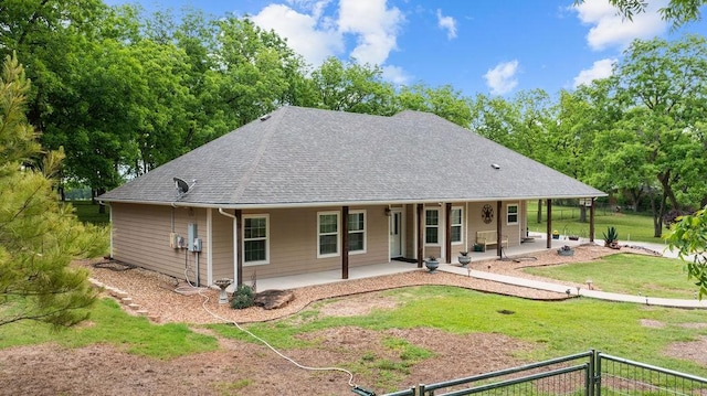 502 Smith Oak Rd, Sherman, TX 75090 - rear view of property featuring covered porch, a yard, and roof with shingles