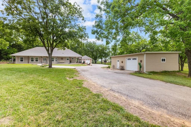 502 Smith Oak Rd, Sherman, TX 75090 - ranch-style home with a detached garage, an outdoor structure, a front lawn, and driveway