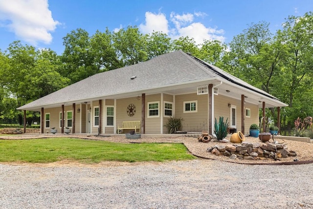 502 Smith Oak Rd, Sherman, TX 75090 - view of front facade featuring covered porch, a shingled roof, a front lawn, and solar panels