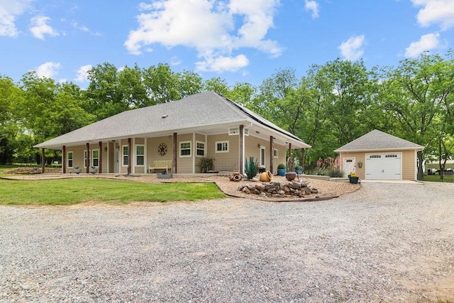 502 Smith Oak Rd, Sherman, TX 75090 - view of front of home with gravel driveway, a detached garage, an outbuilding, and a porch