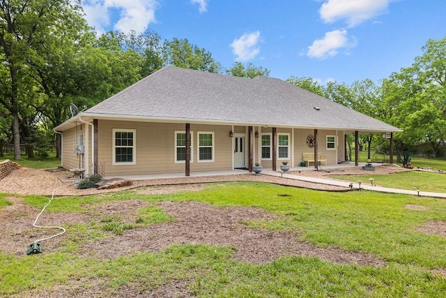 502 Smith Oak Rd, Sherman, TX 75090 - farmhouse with a shingled roof, a front yard, and a patio area