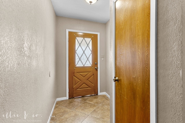 doorway featuring light tile patterned floors