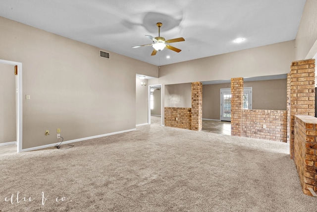 unfurnished living room featuring carpet and ceiling fan