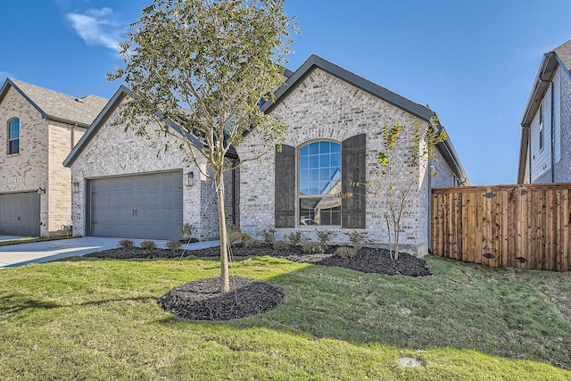 view of front facade with a front lawn and a garage