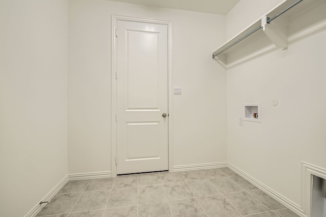 washroom featuring washer hookup, light tile patterned flooring, and gas dryer hookup