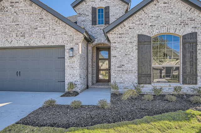 entrance to property featuring a garage