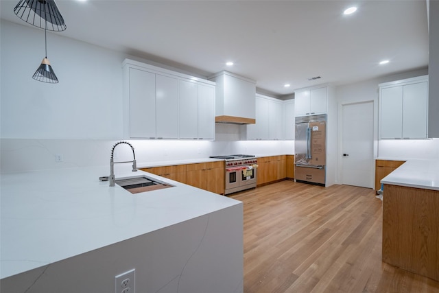 spare room with light hardwood / wood-style floors and ceiling fan