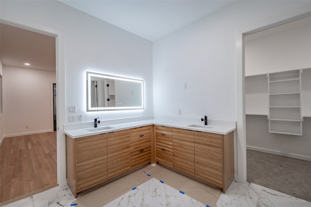 clothes washing area featuring cabinets