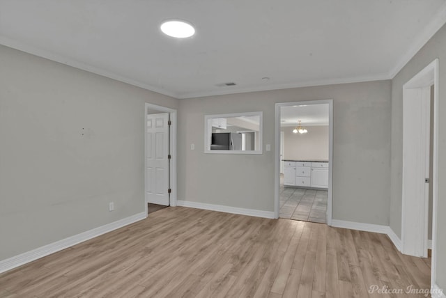 unfurnished bedroom with ornamental molding, ensuite bath, a notable chandelier, stainless steel refrigerator, and light hardwood / wood-style flooring