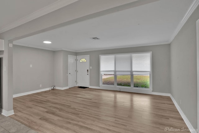 interior space with light wood-type flooring and ornamental molding