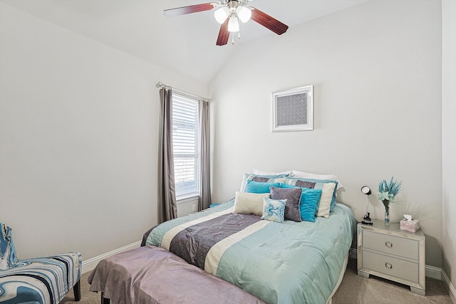 bedroom with vaulted ceiling, light carpet, and ceiling fan