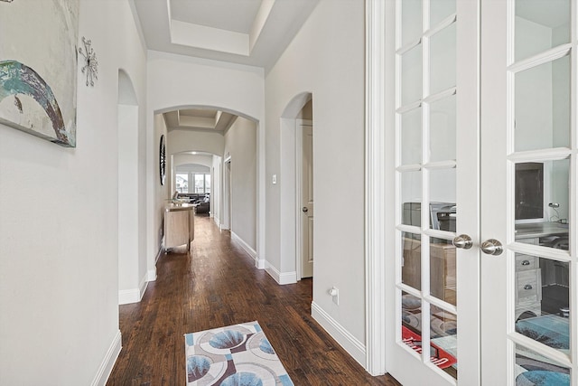 hallway featuring french doors and dark hardwood / wood-style flooring