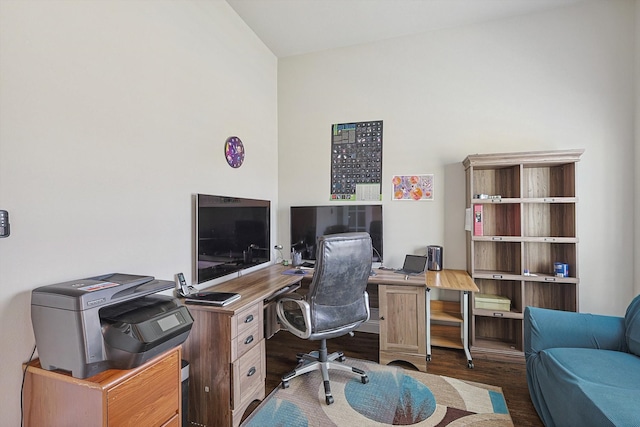 office area featuring dark hardwood / wood-style floors and vaulted ceiling