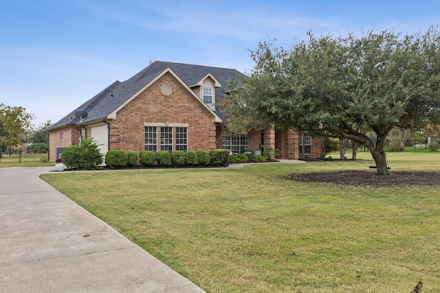 view of front of home with a front yard and a garage