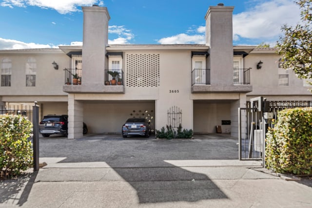 rear view of property featuring a balcony