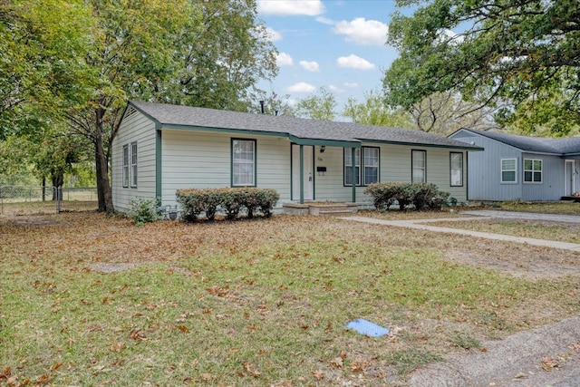 single story home featuring a front lawn