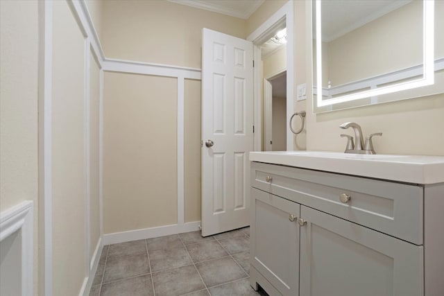 bathroom featuring vanity, ornamental molding, and tile patterned flooring