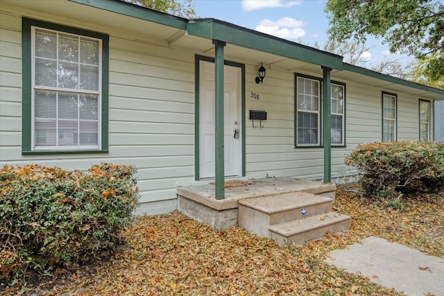 property entrance with covered porch