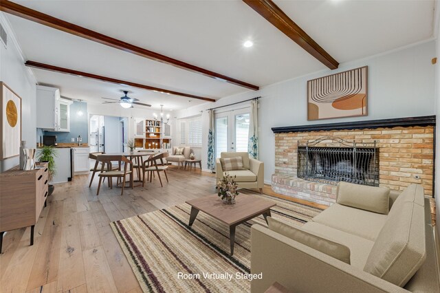 living room with french doors, light wood-type flooring, a brick fireplace, ceiling fan, and beam ceiling