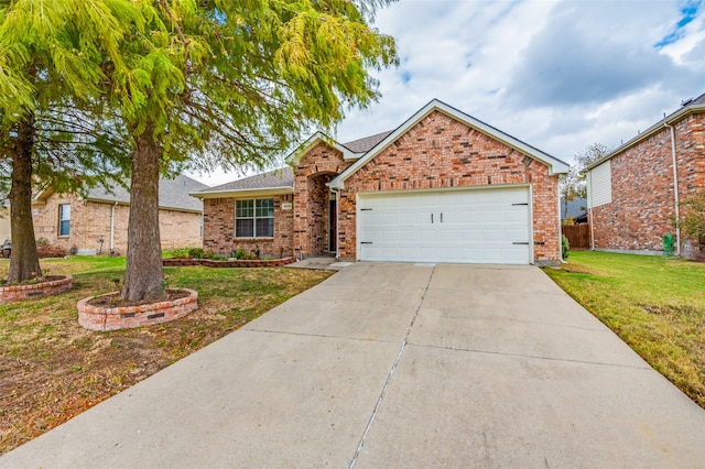 view of front of home with a garage and a front yard