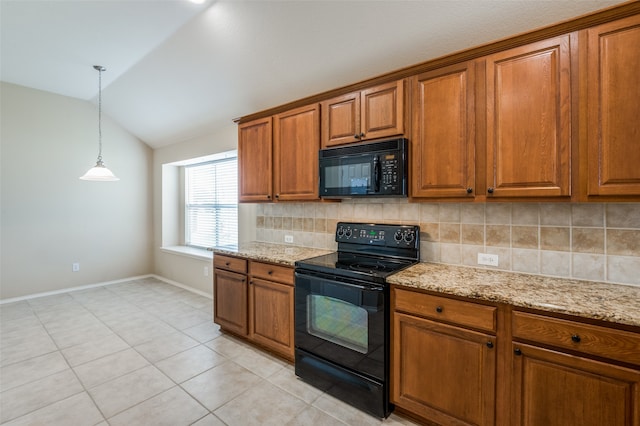 kitchen featuring decorative light fixtures, tasteful backsplash, lofted ceiling, black appliances, and light stone countertops