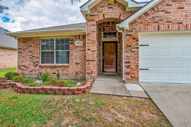 entrance to property featuring a garage