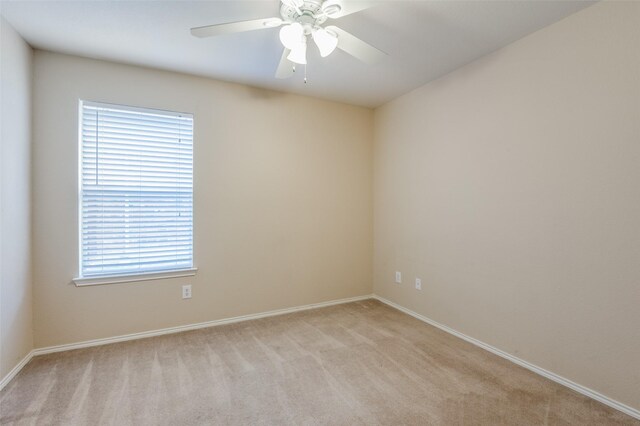 unfurnished bedroom featuring light carpet, ceiling fan, and a closet