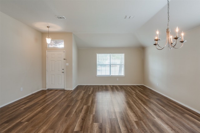 foyer entrance featuring dark wood-type flooring and a wealth of natural light