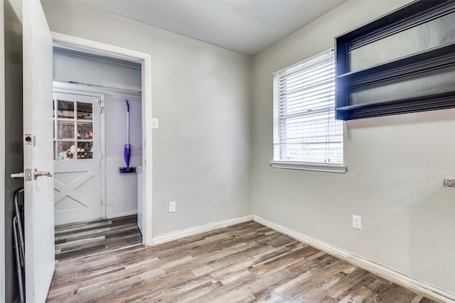 spare room featuring hardwood / wood-style floors