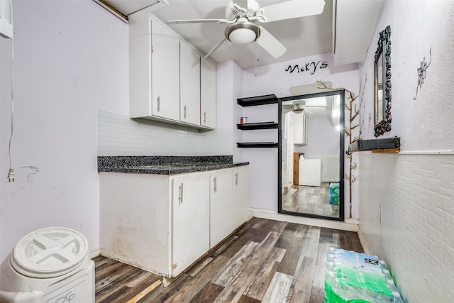 laundry room with dark hardwood / wood-style flooring