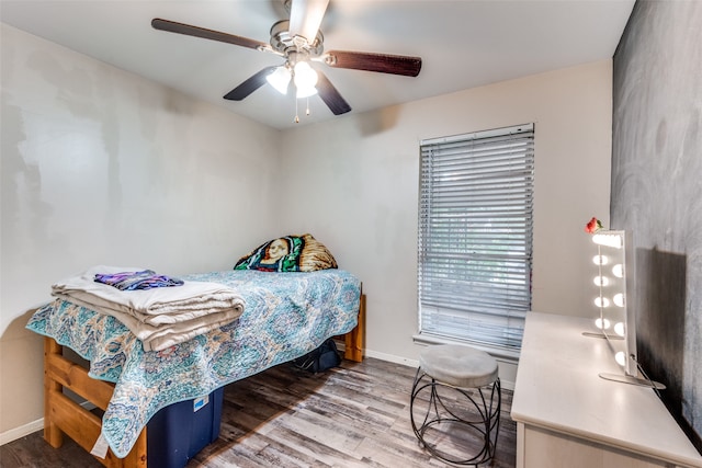 bedroom featuring hardwood / wood-style flooring and ceiling fan