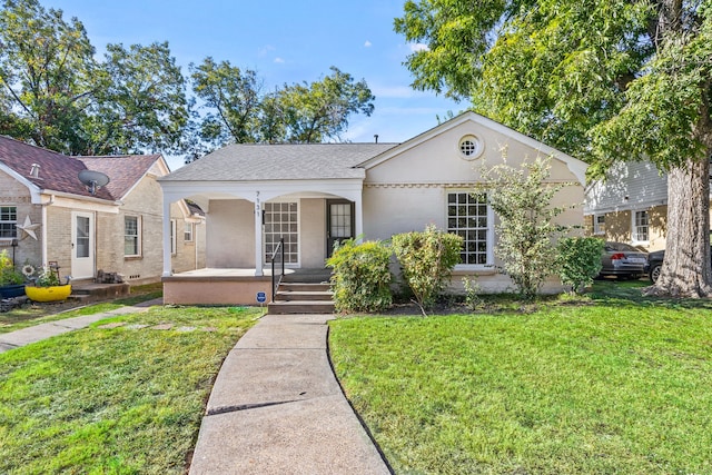 view of front of property featuring covered porch and a front yard