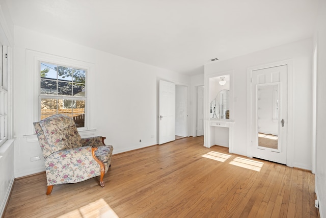 living area with light hardwood / wood-style floors