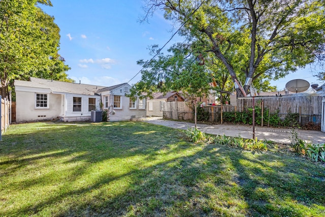 view of yard featuring a patio area and central AC