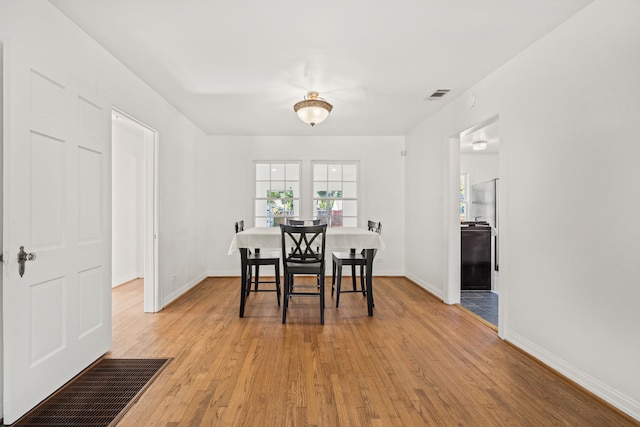 dining room with light wood-type flooring