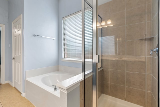 bathroom with tile patterned flooring and plus walk in shower