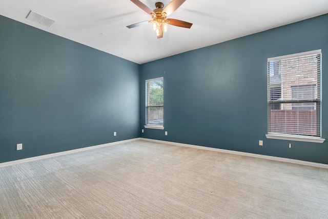 carpeted empty room with ceiling fan