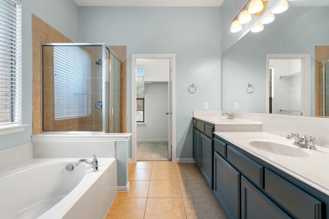 bathroom featuring tile patterned floors, vanity, and plus walk in shower