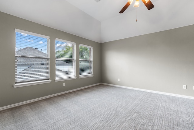 unfurnished room featuring carpet, ceiling fan, and lofted ceiling