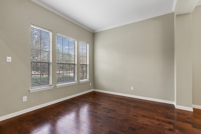 unfurnished room featuring dark wood-type flooring and ornamental molding