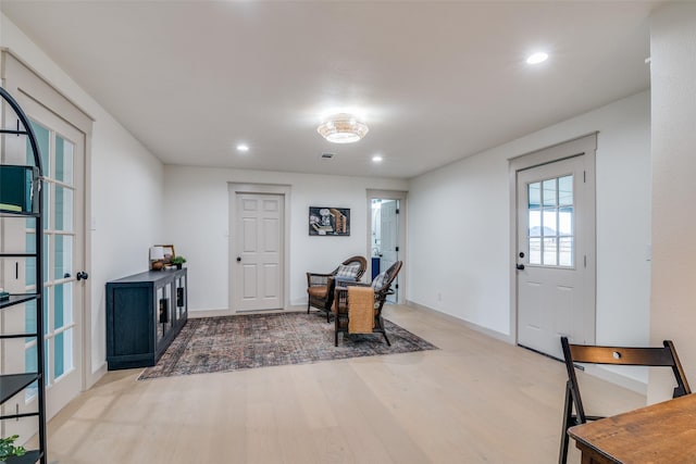 entryway with french doors and hardwood / wood-style floors