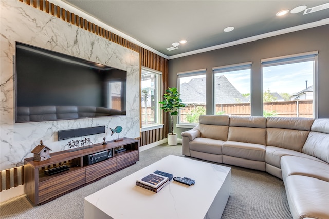 carpeted living room with crown molding