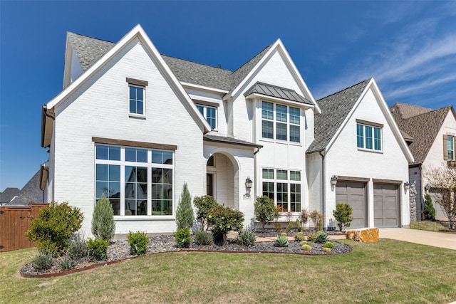 view of front of home featuring a front lawn and a garage