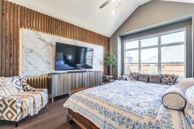 bedroom with ceiling fan, lofted ceiling, and dark hardwood / wood-style flooring