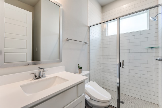 bathroom with vanity, toilet, tile patterned floors, and a shower with door