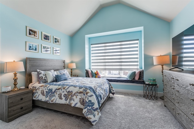 carpeted bedroom featuring vaulted ceiling