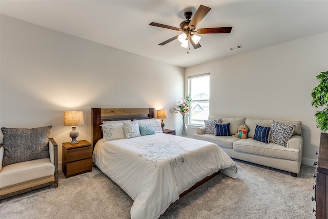 bedroom featuring light carpet and ceiling fan