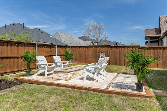 view of yard with a patio and an outdoor fire pit